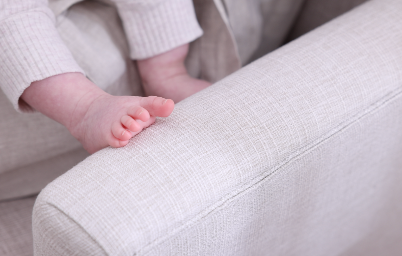iL Tutto Baby feet on Chelsea Nursery Chair